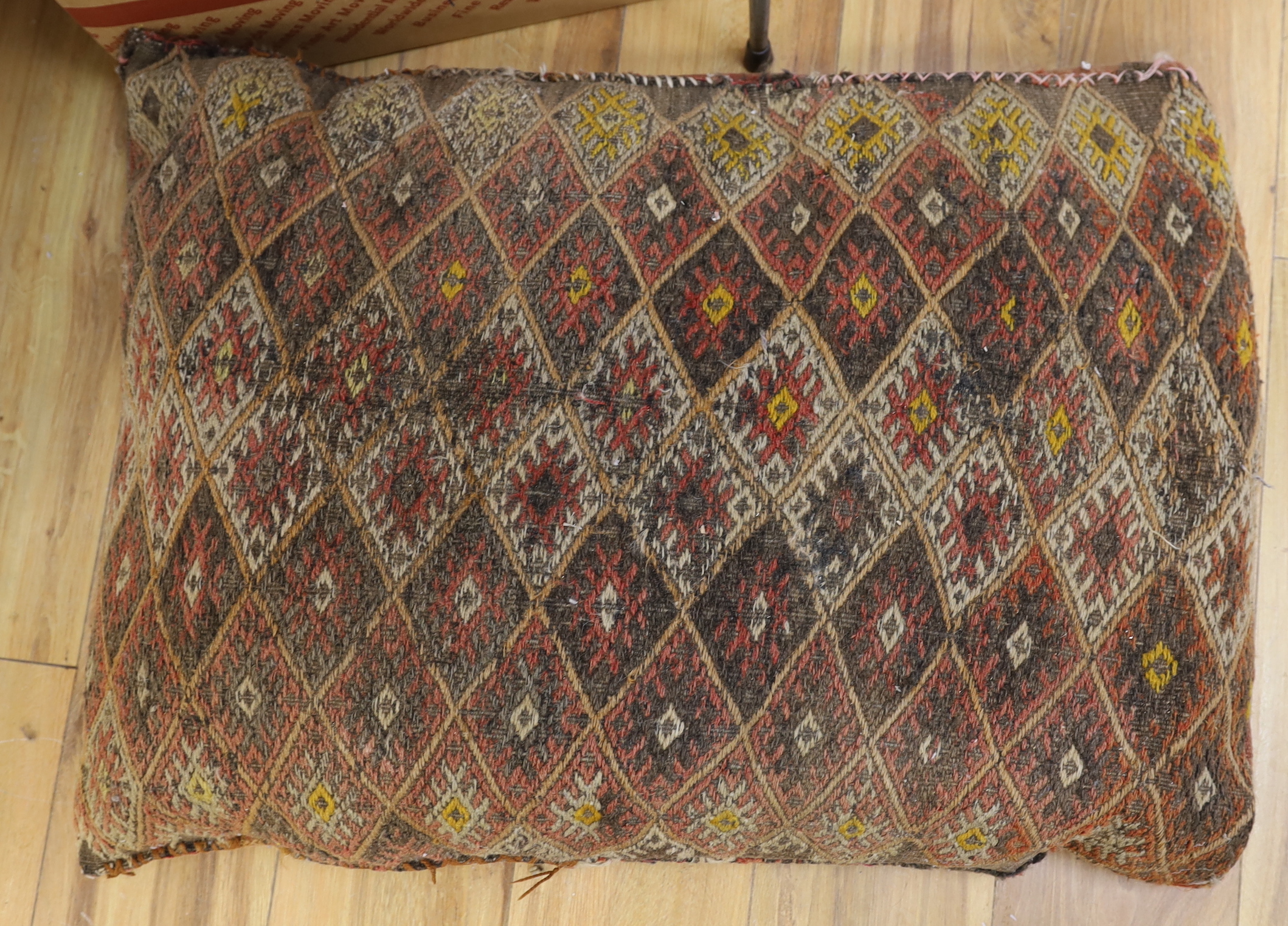 Two floral beadwork foot stools and a large Kilim cushion, the largest 75cm x 55cm